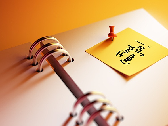 notebook with yellow post-it saying 'find new job'